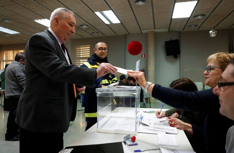 A man votes in Catalonia's regional elections at a polling station in Barcelona