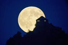 Profile Somoskoujfalu Castle, 123 km northeast of Budapest (Hungary), brand image of the full moon.