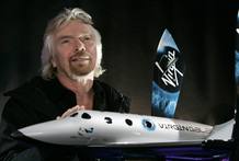 Richard Branson, founder of Virgin and Virgin Galactic, with a model of their spacecraft, on an image to 2008.