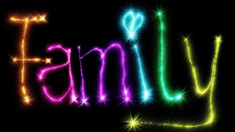 Palabra "Family" en luces de colores, con un corazón en lugar del punto de la "i". Estilo cursiva sobre fondo negro.
