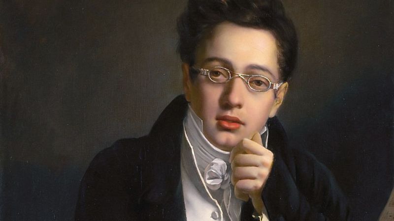 Retrato al �leo del siglo XIX de un joven m�sico con gafas y levita oscura, posando pensativo junto a una partitura.