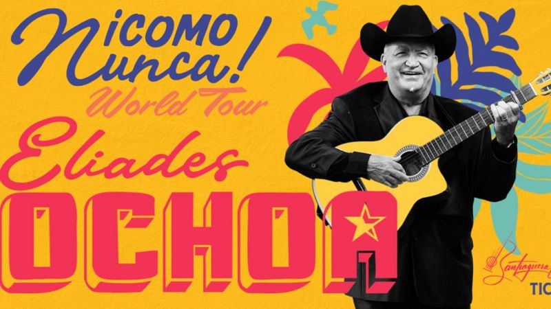 Cartel de la gira «¡Como Nunca! World Tour» de Eliades Ochoa sobre fondo amarillo, mostrando al músico sonriente con su guitarra y sombrero negros junto a coloridas tipografías.