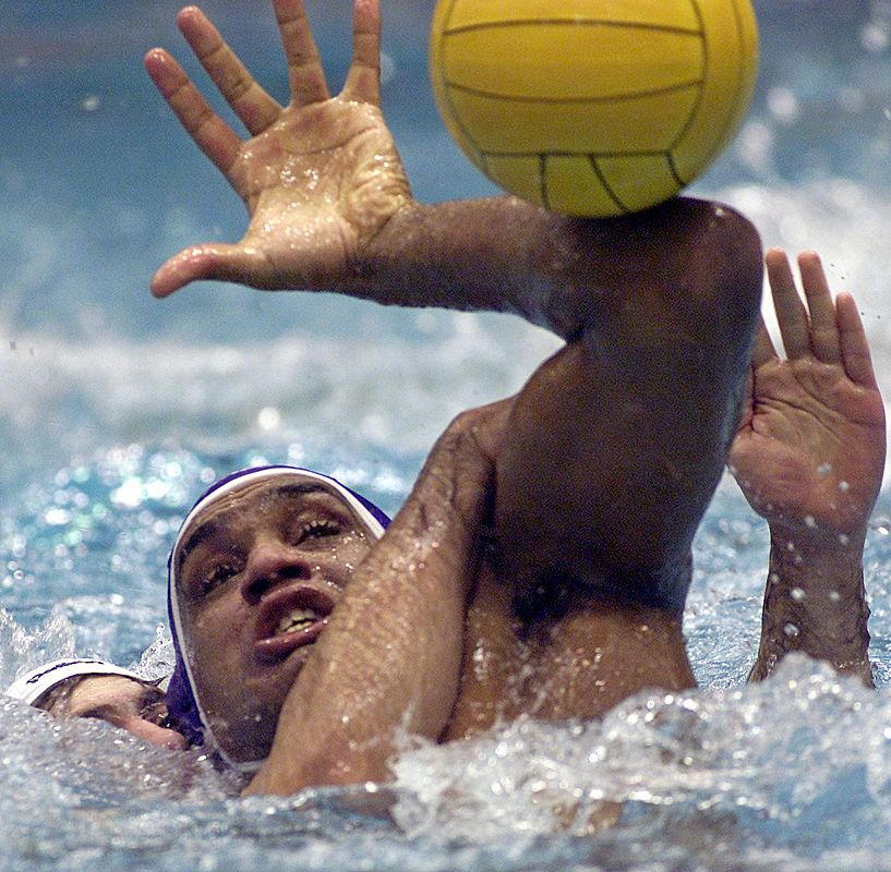 PEREZ OF BARCELONA STRUGGLES FOR THE BALL WITH TICIC OF PARTIZAN DURING