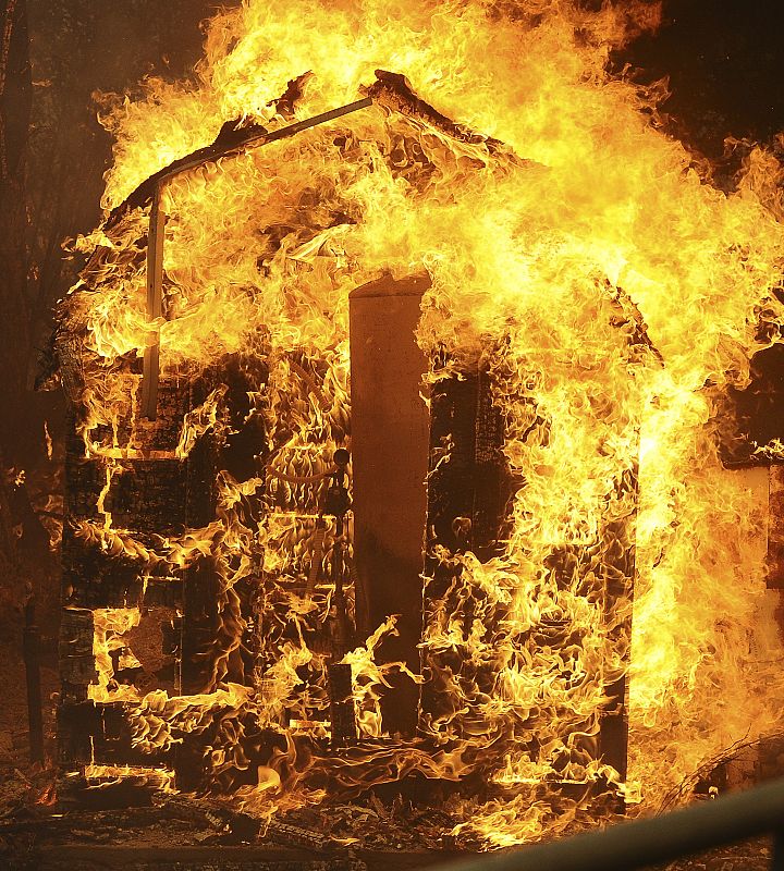 An unknown structure burns during the Station Fire in the Big Tujunga Canyon area of Los Angeles