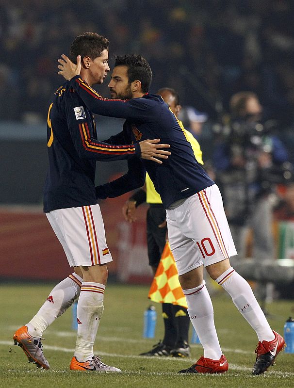 Spain's Torres is substituted as Fabregas comes on during a 2010 World Cup Group H match against Chile at Loftus Versfeld stadium in Pretoria