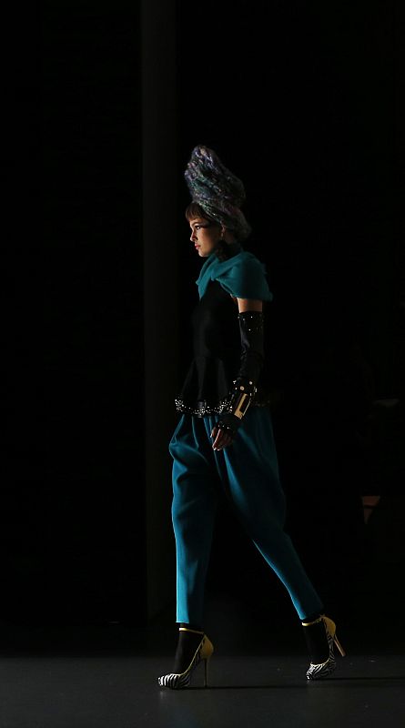 A model presents a creation from designer Maria Barros' Fall/Winter 2013 collection during the Mercedes-Benz Fashion Week in Madrid