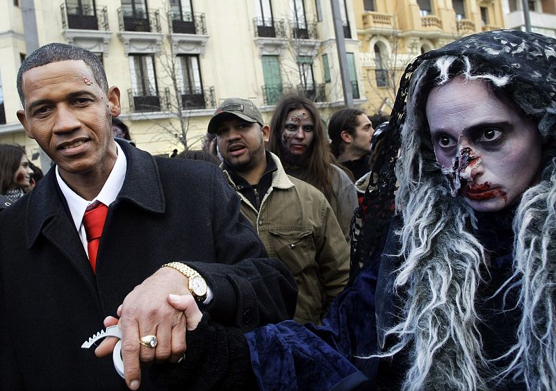 A U.S. President Barack Obama lookalike wearing zombie facial make-up takes part in a zombie gathering in Madrid