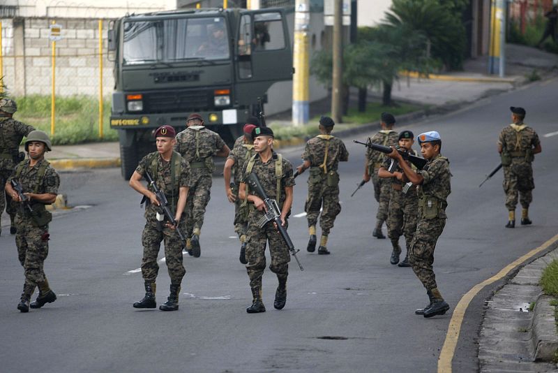 Honduran soldiers block a street near the residence of Honduras' President Manuel Zelaya in Tegucigalpa