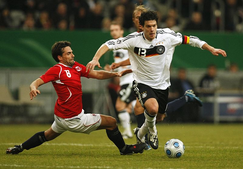 Norway's Braaten challenges Germany's Ballack during friendly match in Duesseldorf