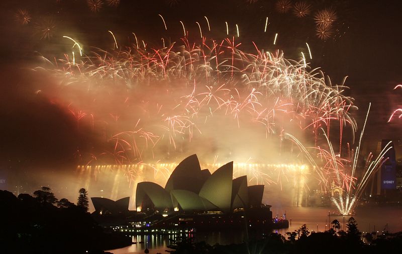 Fireworks explode over the Sydney Harbour Bridge and Opera House during a pyrotechnic show to celebrate the New Year