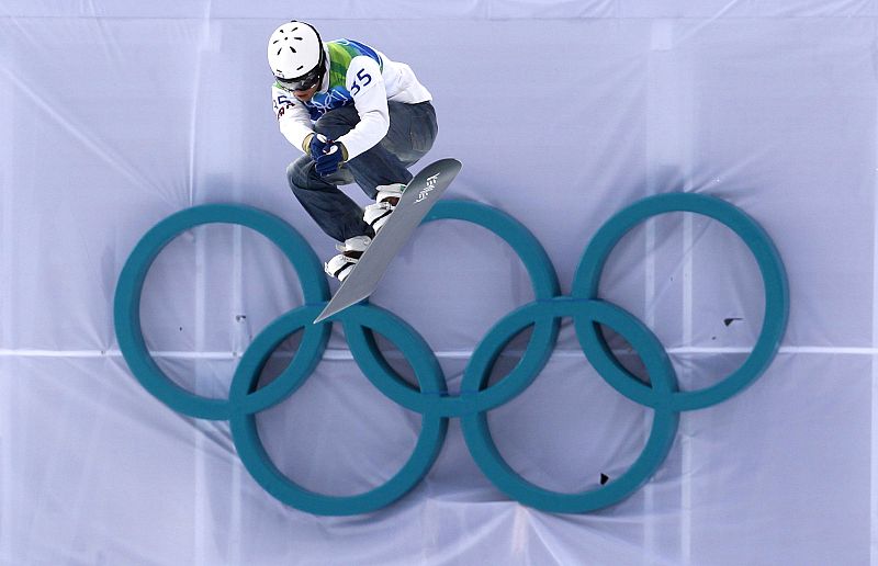 Watanabe of the U.S. competes during the men's snowboard cross qualifying at the Vancouver 2010 Winter Olympics