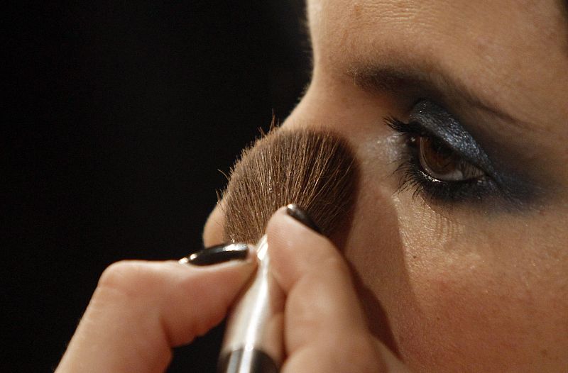 A model gets her make up done as she prepares for show of Spanish designer Francis Montesinos during Cibeles Madrid Fashion Week Fall/Winter 2010 show in Madrid