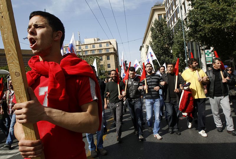 Protesters shout slogans as they march to the parliament during an anti-government rally in Athens