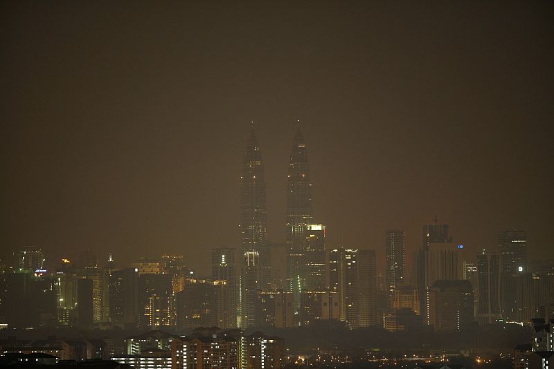 The lights of Malaysia's landmarks Petronas Twin Towers are turned off during the Earth Hour in Kuala Lumpur