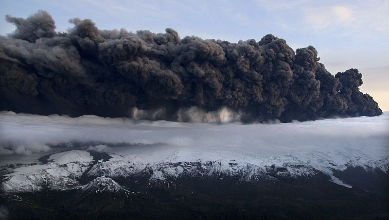 A plume of volcanic ash rises into the atmosphere from a crater under about 656 feet of ice at the Eyjafjallajokull glacier