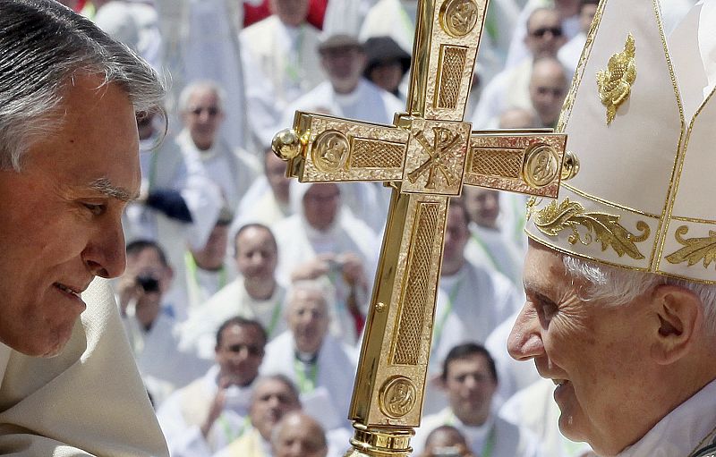 Pope Benedict XVI greets Portugal's President Anibal Cavaco Silva at the end of a mass in Fatima