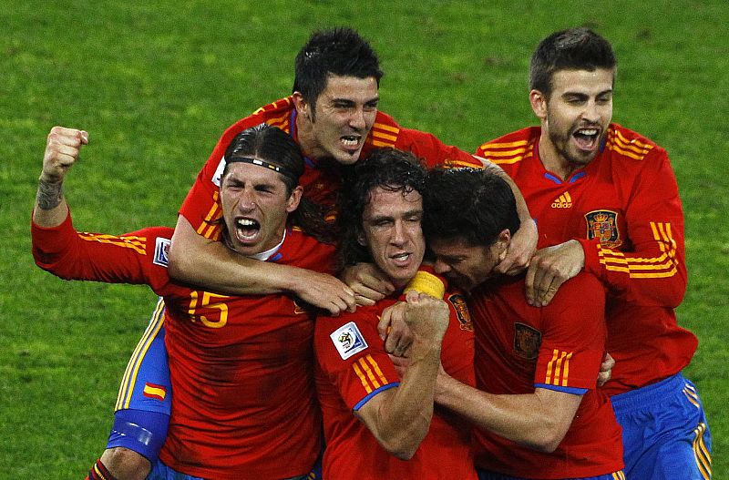 Spain's Puyol celebrates with team mates after scoring against Germany during their 2010 World Cup semi-final soccer match at Moses Mabhida stadium in Durban