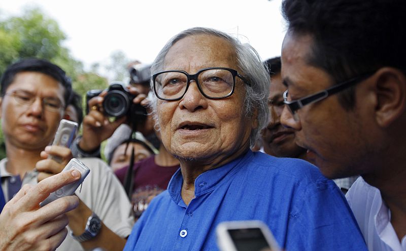 U Win Tin, a politician, is surrounded by the media at the headquarters of the NLD party in Yangon