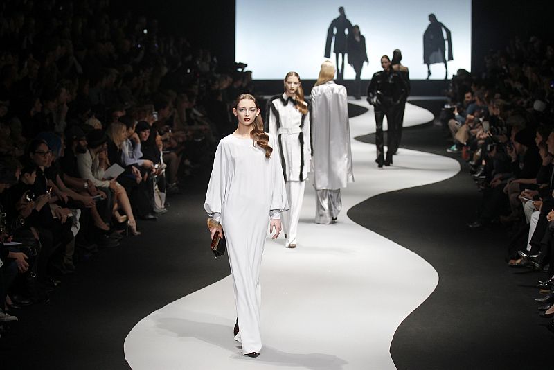 Models present creations by Dutch designers Viktor and Rolf as part of their Fall/Winter 2012-2013 women's ready-to-wear fashion show during Paris fashion week