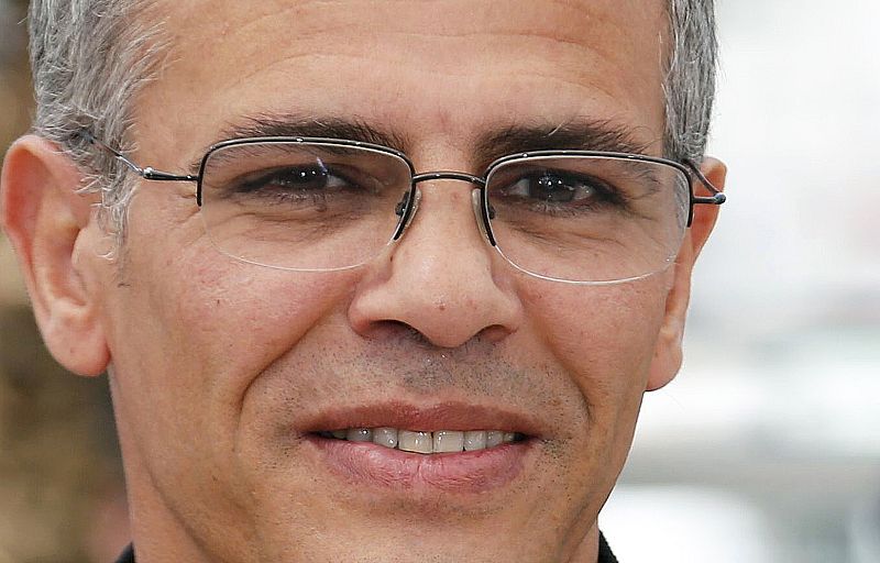 Director Abdellatif Kechiche poses during a photocall for the film "La Vie D'Adele" at the 66th Cannes Film Festival