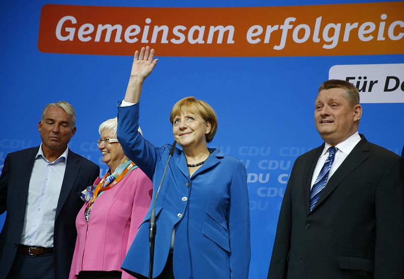 German Chancellor Merkel arrives to address supporters after first exit polls in German general election at the CDU party headquarters in Berlin