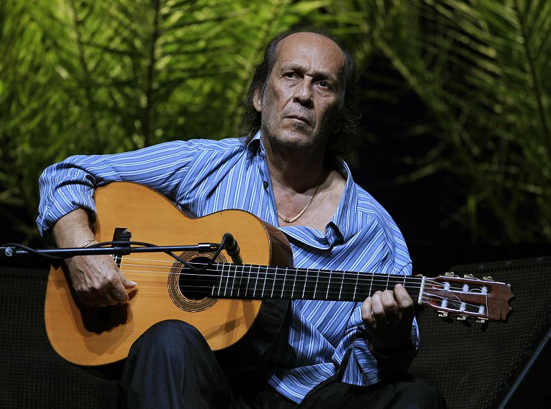 File photo of Spanish flamenco guitarist de Lucia playing a guitar during a rehearsal of closing concert of the Biennial of Flamenco in Seville