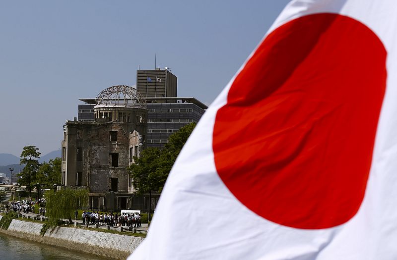 The Japanese national flag is seen near the Atomic Bomb Dome in Hiroshima
