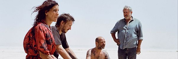 This image released by Neon shows, from left, Stefania Gadda, Joshua Liam Herderson, Richard Bellamy and Sergi López in a scene from the film "Sirat." (Neon via AP)