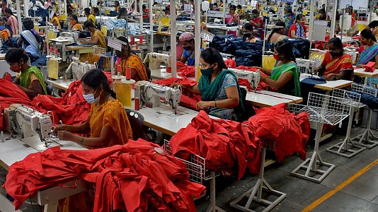 Garment workers stitch shirts at a textile factory in Hindupur town in the southern state of Andhra Pradesh, India, February 9, 2022
