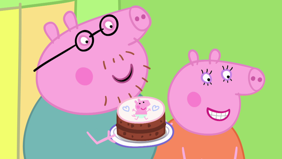 Papá y Mamá Pig observan una tarta de chocolate con decoración infantil.  El título 'El gran anuncio' indica una celebración.