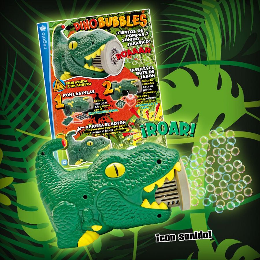 Dinosaurio verde que lanza burbujas, con sonido. Aparece en portada de revista infantil, ofrecido como regalo.