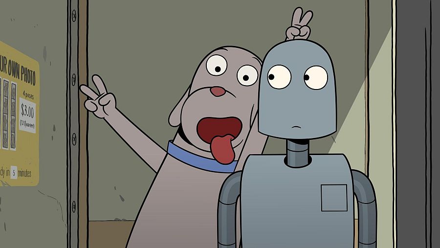 Perro y robot en un fotomatón; el perro hace la señal de paz sobre el robot. Cartel: 4 poses, $3.00, listo en 5 minutos.