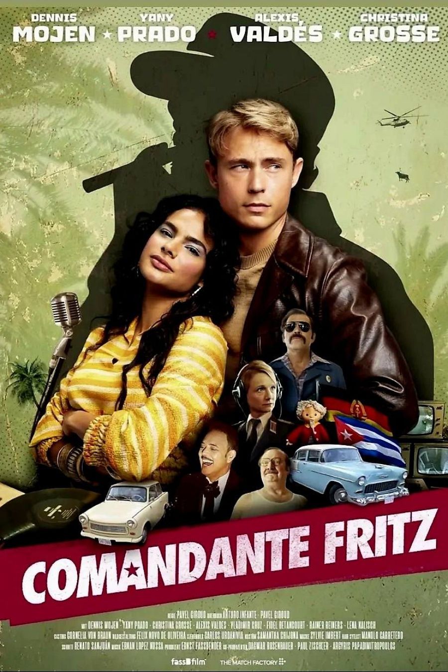 Cartel de la película "Comandante Fritz" con Yany Prado y Alexis Valdés como protagonistas.  Se aprecian otros personajes, un coche clásico americano, un Trabant y una bandera cubana.
