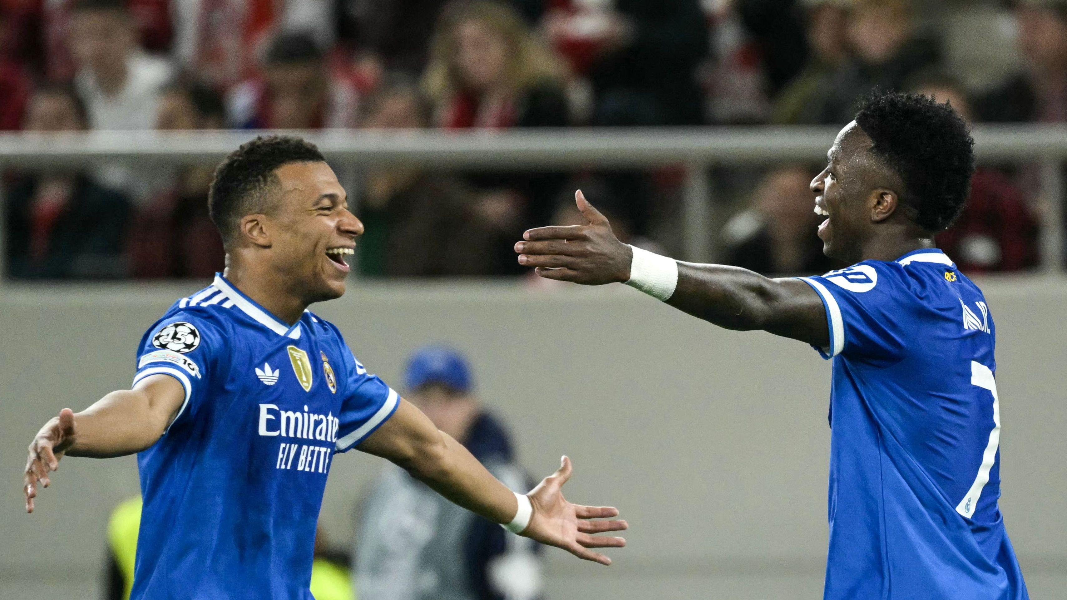 Mbappe and Vinicius embrace