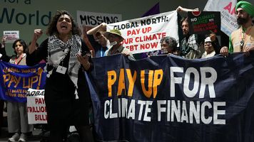 Protesta en la COP9 para exigir una financiación climática más ambiciosa