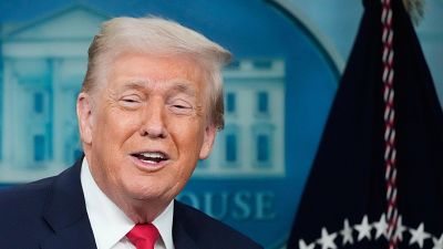 President Donald Trump speaks during a press briefing at the White House in Washington, Tuesday, Jan. 20, 2026. (AP Photo/Mark Schiefelbein)
