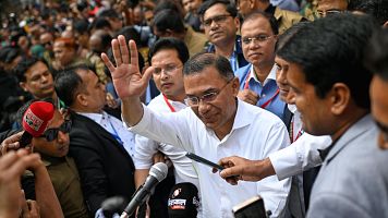 Bangladesh Nationalist Party Chairperson Tarique Rahman waves as he comes out after casting his vote during the national parliamentary elections in Dhaka, Bangladesh, Thursday, Feb. 12, 2026. (AP Photo/Mahmud Hossain Opu)