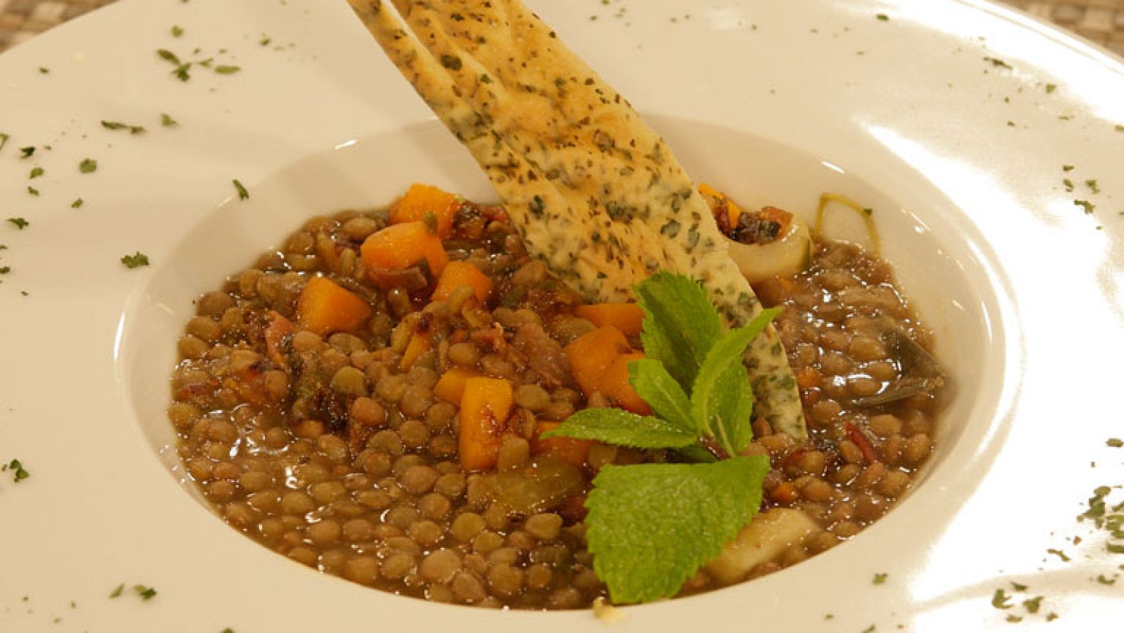 Lentejas con calabaza y calamares al ajillo