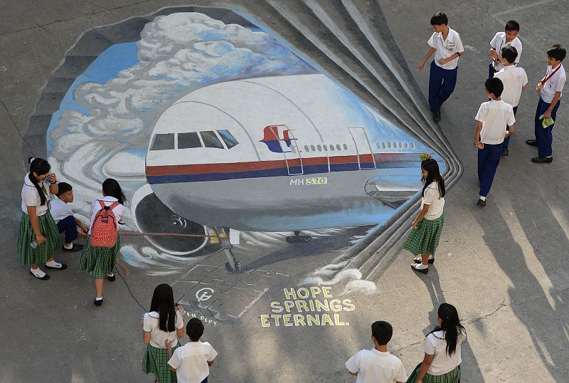 China busca por tierra el avión malasio mientras algunos familiares plantean una huelga de hambre