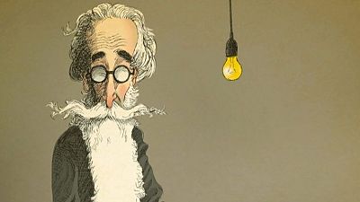 Caricatura de Valle-Inclán con barba blanca, gafas y cabello gris; bombilla amarilla iluminada al lado, sobre fondo beige. Caricatura de Valle-Inclán con barba blanca, gafas y cabello gris; bombilla amarilla iluminada al lado, sobre fondo beige.