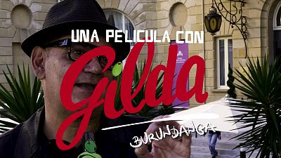 José Corbacho, con sombrero y gafas, promociona "UNA PELÍCULA CON Gilda BURUNDANGA" frente al Hotel María Cristina en el Festival de Cine de San Sebastián. José Corbacho, con sombrero y gafas, promociona "UNA PELÍCULA CON Gilda BURUNDANGA" frente al Hotel María Cristina en el Festival de Cine de San Sebastián.