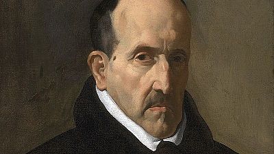 Velázquez retrata a Góngora, hombre de mediana edad con expresión seria, bigote y gorguera blanca sobre ropa oscura, sobre un fondo neutro. Velázquez retrata a Góngora, hombre de mediana edad con expresión seria, bigote y gorguera blanca sobre ropa oscura, sobre un fondo neutro.