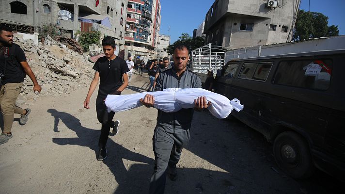 Telediario 1 - 20 palestinos mueren aplastados buscando comida