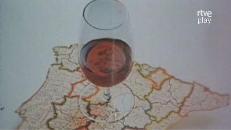 Vaso de vino tinto sobre mapa de Espa�a con regiones delimitadas. Logotipo 'rtve play' en esquina superior derecha.