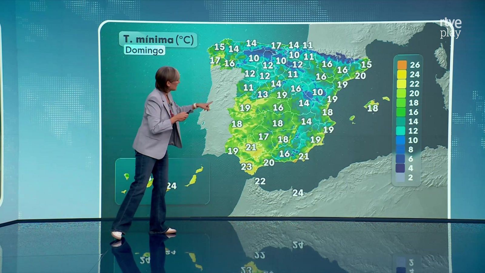Presentadora de RTVE detalla temperaturas mínimas del domingo en España en un mapa digital con números y escala de colores.