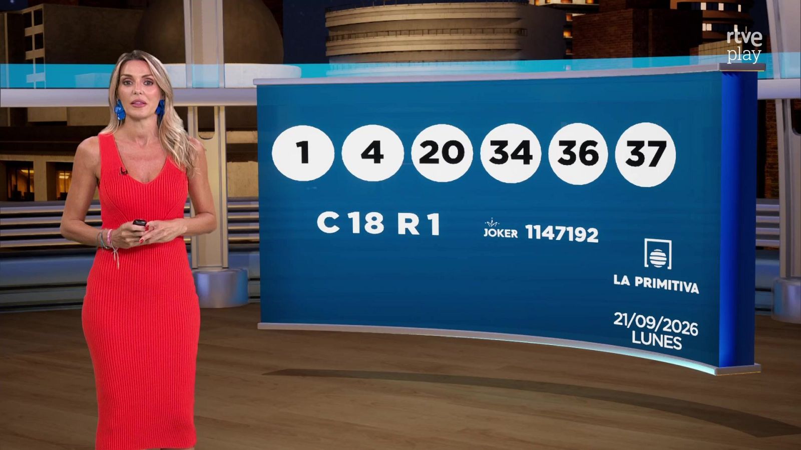 Presentadora en estudio con pantalla mostrando resultados de "La Primitiva" del 21/09/2026: números 1, 4, 20, 34, 36, 37, C 18, R 1, Joker 1147192.