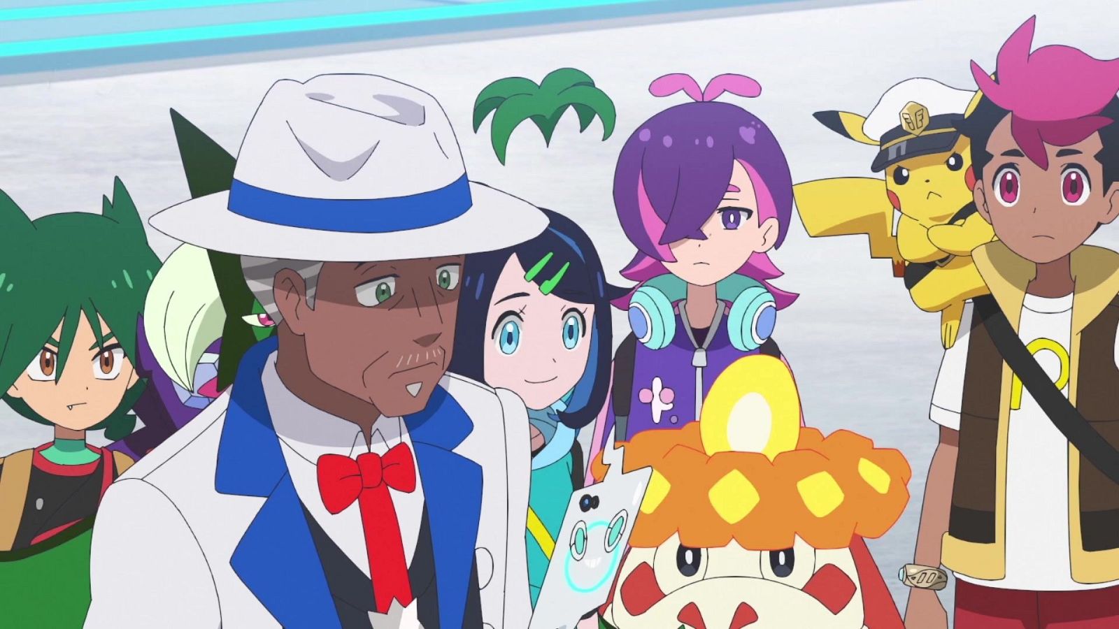 Grupo de personajes de "Pokémon Horizontes" con Friede, Liko, Mollie, Dot, Roy, Capitán Pikachu y Fuecoco en un interior moderno. Fondo blanco y azul.