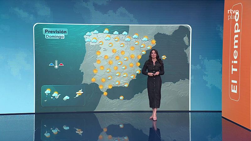 La presentadora Núria Seró presenta la previsión meteorológica de España en el plató de RTVE ante un gran mapa con iconos de sol y lluvia.