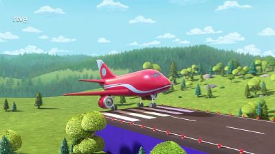 Avión comercial rojo y blanco sobre pista elevada en un paisaje natural con colinas verdes y cielo despejado.