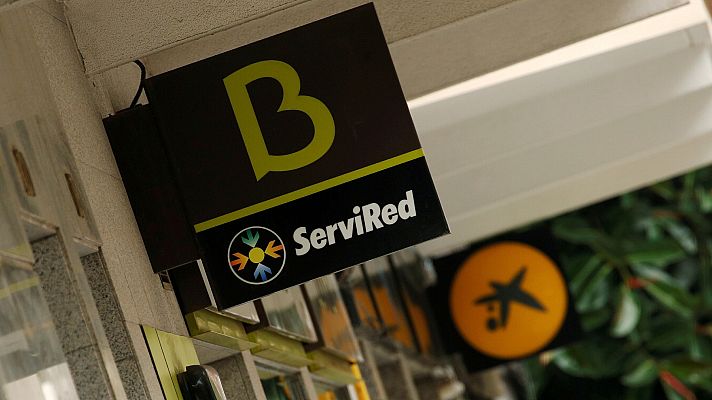 Telediario 1 - Bankia deja de cotizar en bolsa y se da de baja como sociedad mercantil como pasos previos a su integración en CaixaBank